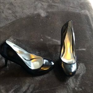 Black patent leather round toe heels